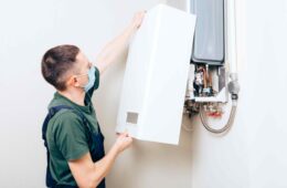 plumber-attaches-trying-fix-problem-with-residential-heating-equipment-repair-gas-boiler